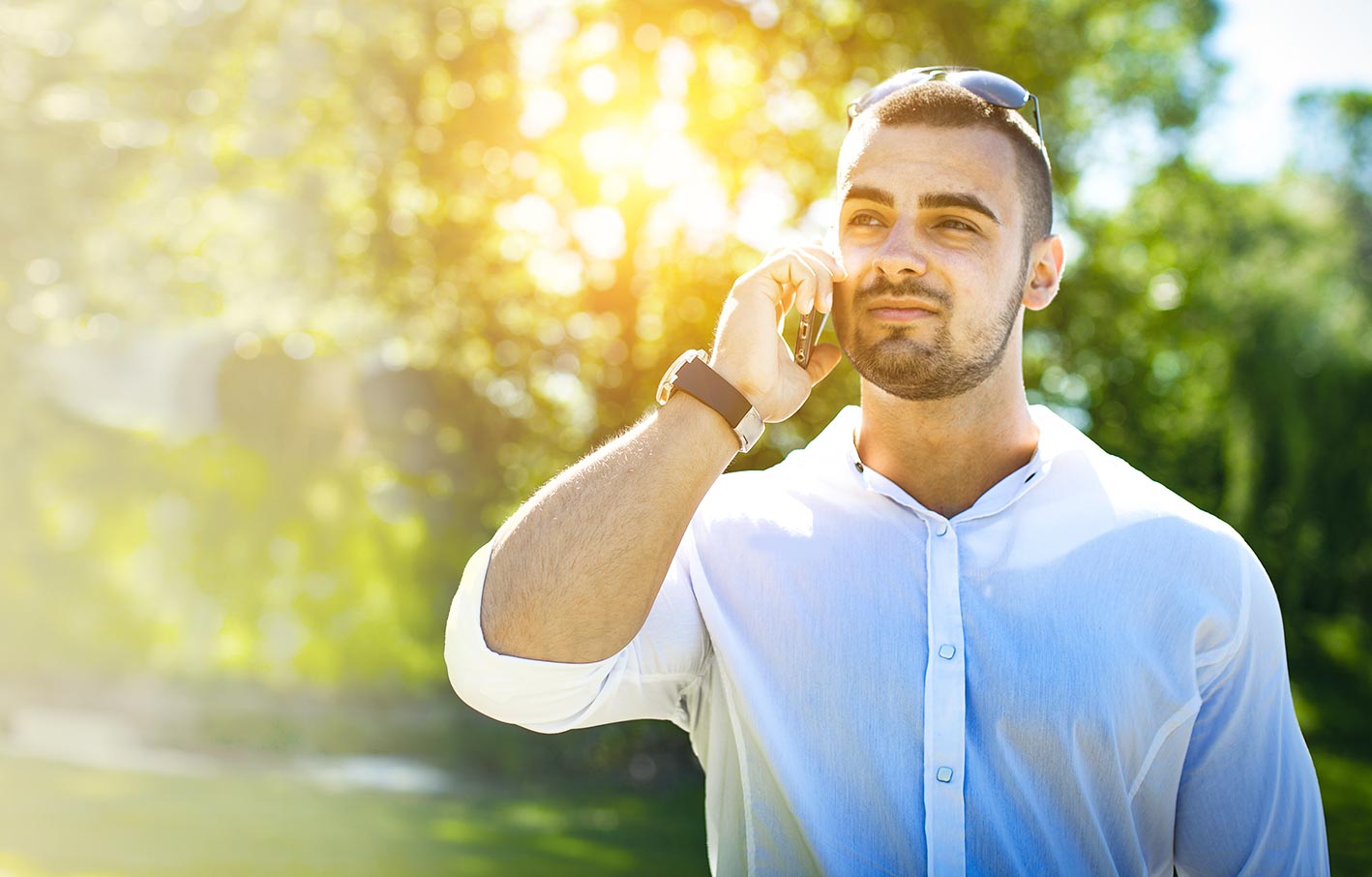 a man wearing white polo making a call to a treatment center in Menifee