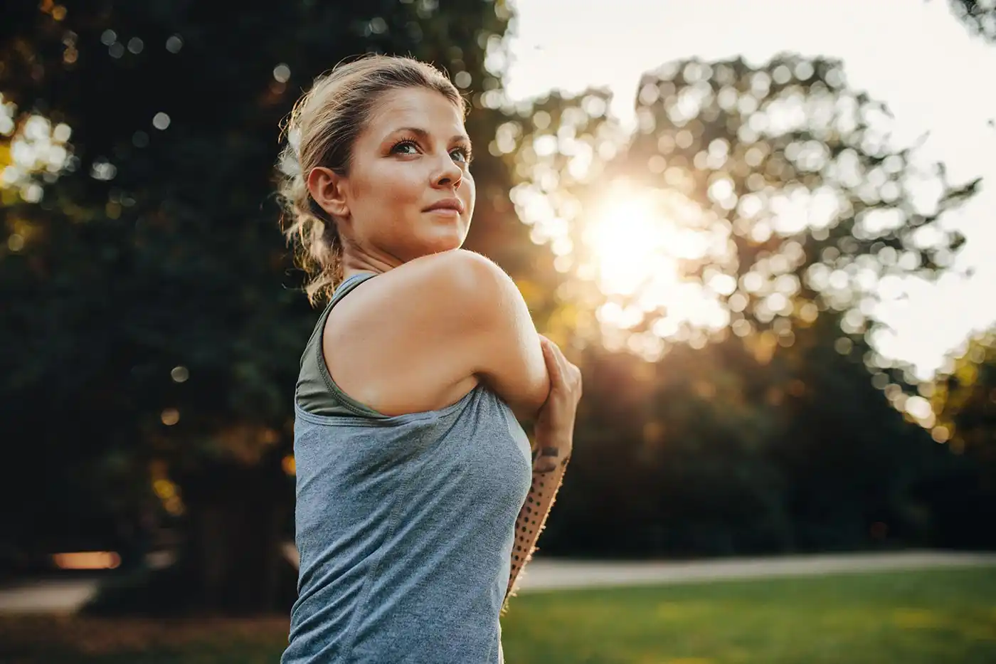 a woman doing some exercises outdoor