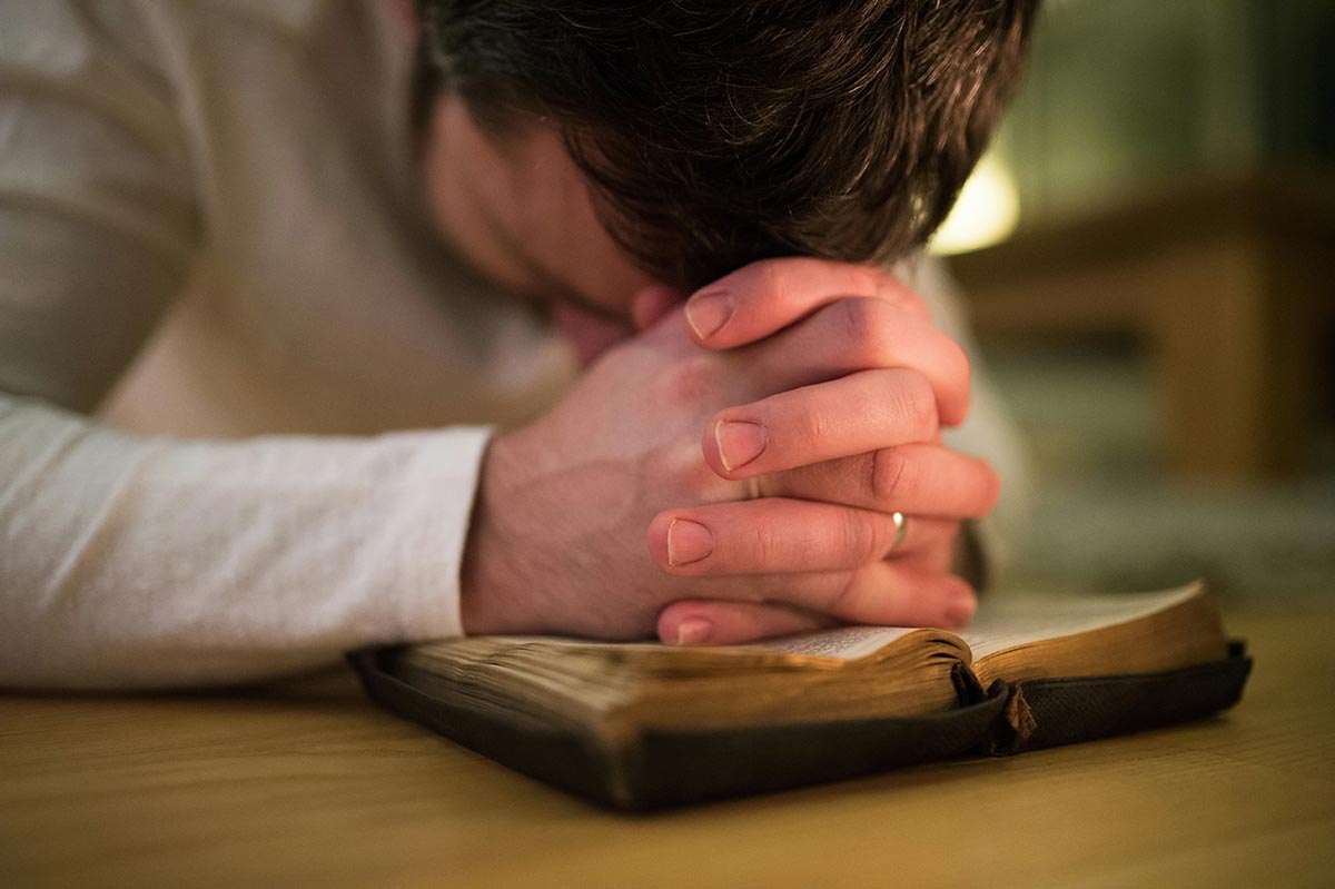 man praying for spiritual awakening in menifee drug and alcohol rehab center