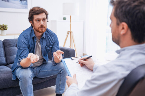 man during consultation about outpatient program