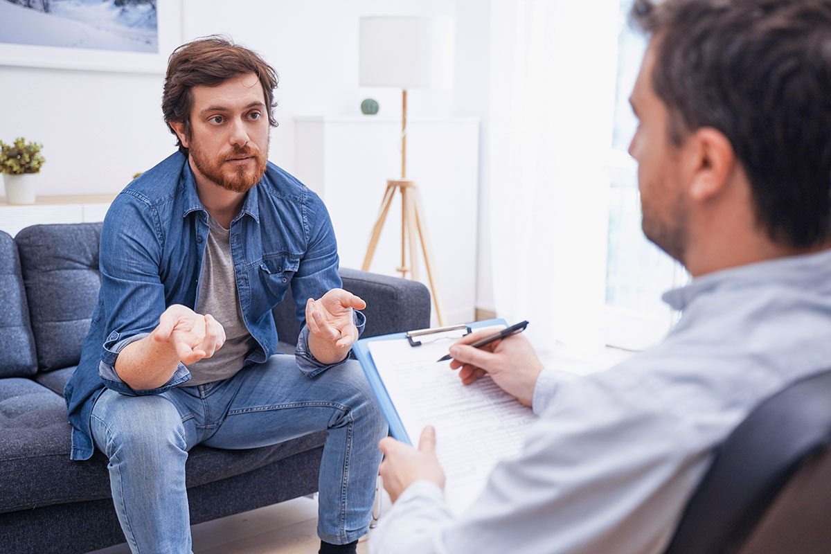 man during consultation about outpatient program