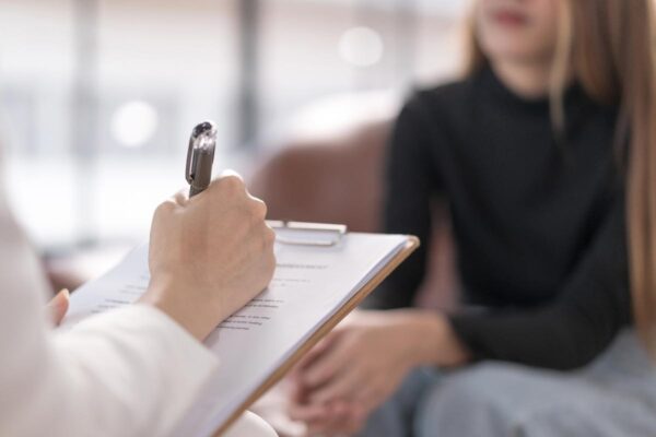 a female client and a psychologist during assessment from the admission office at a drug and alcohol rehab