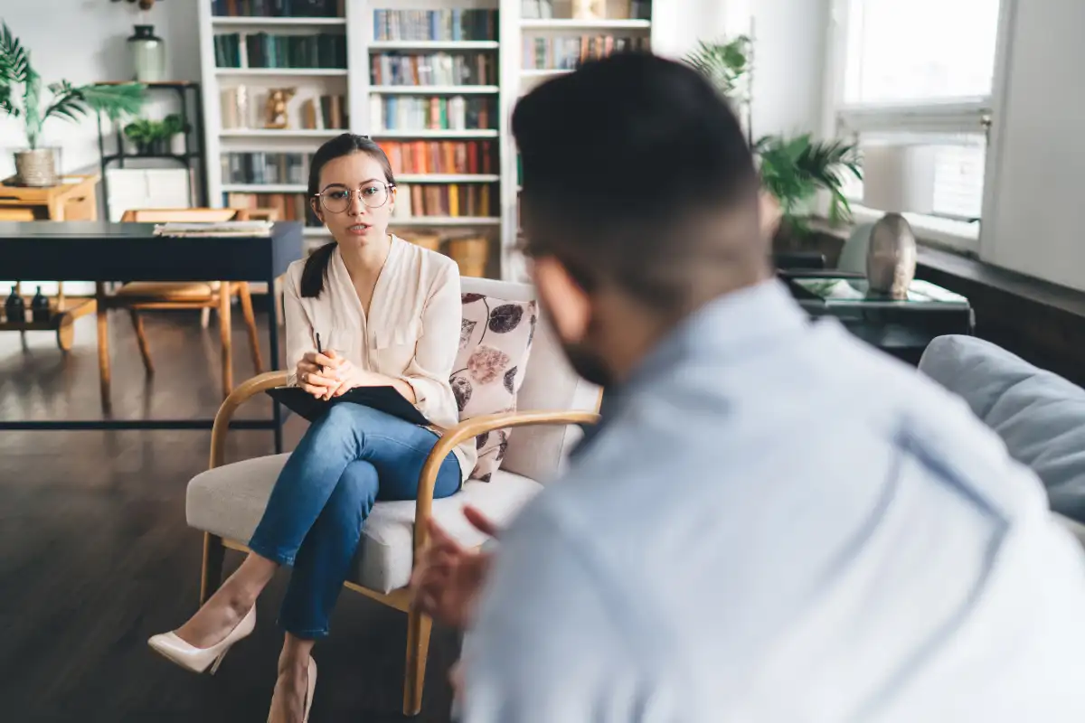 Psychologist Asking Questions to a male Client