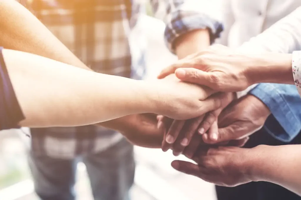 people hand assemble community support