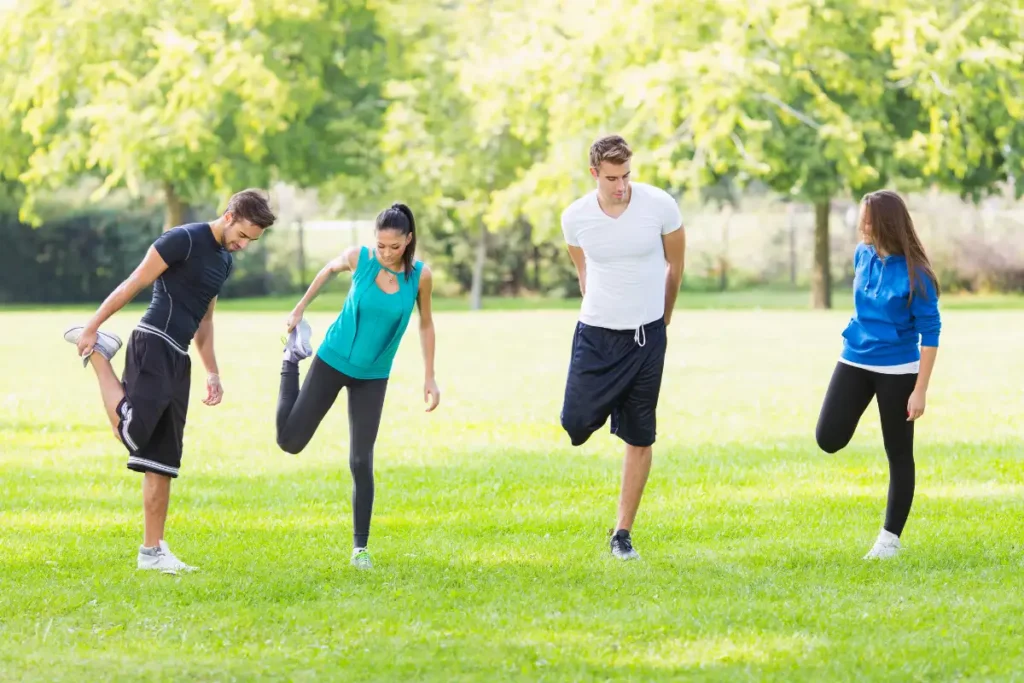 men and women doing exercises outdoor during warm weather in drug and alcohol rehab in corona california