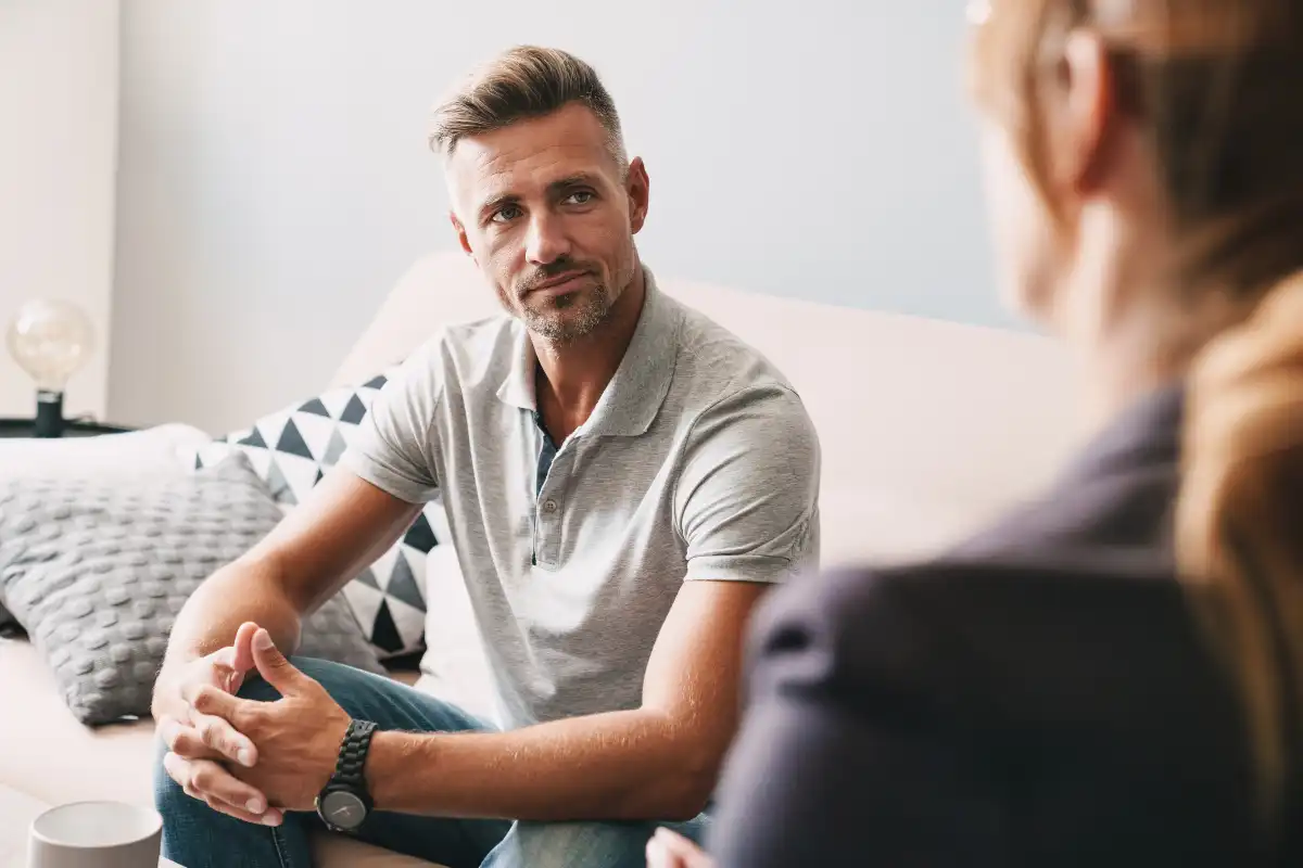 a male client during one on one therapy with a female psychotherapist