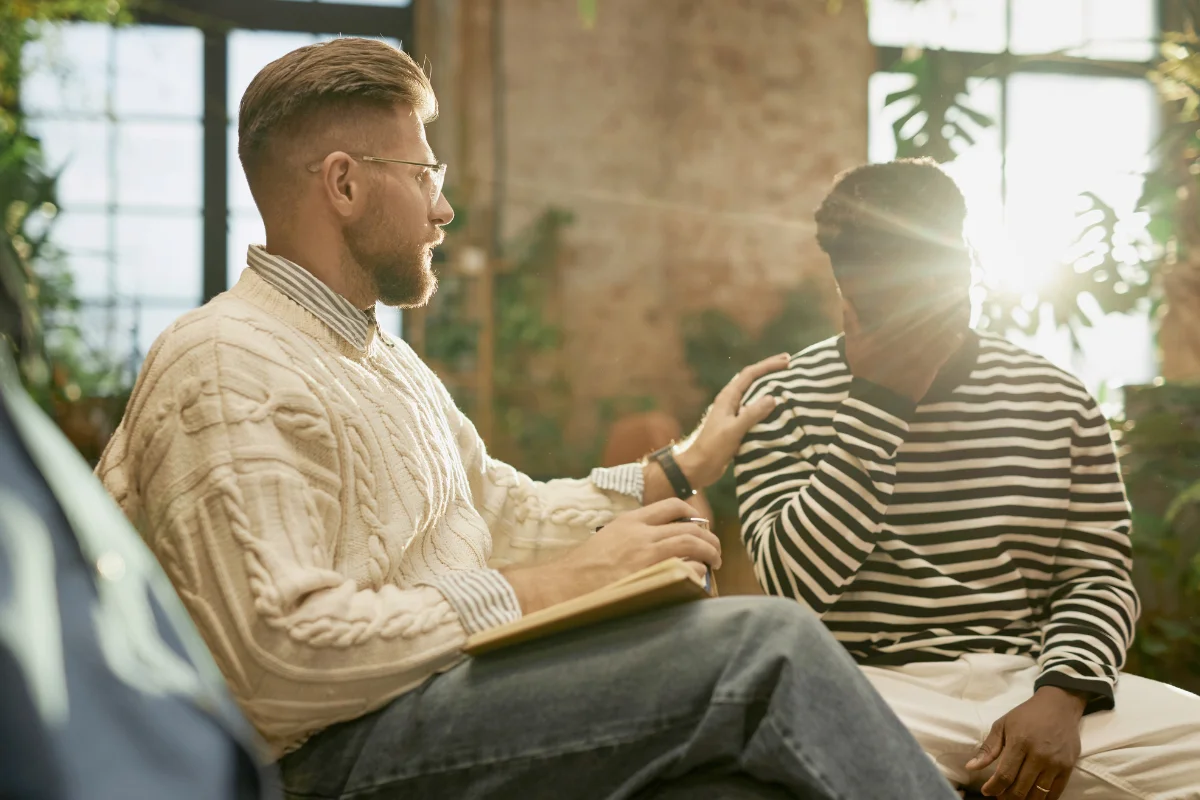 Male Psychologist Supporting Client