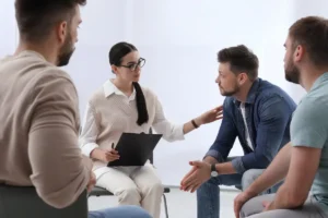 Psychotherapist working with people in drug and alcohol treatment facility