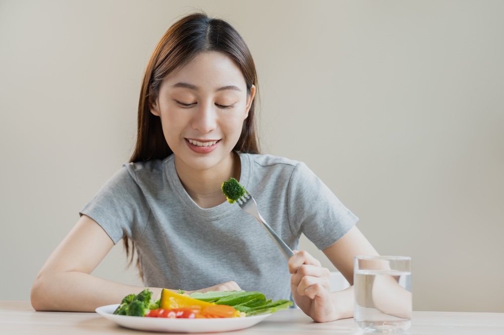 Female eating mindfully during addiction recovery