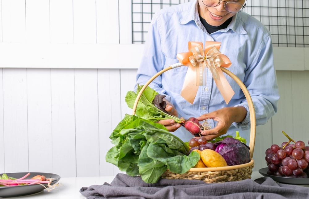 Lady in addiction recovery receiving a healthy food basket on his sober anniversary