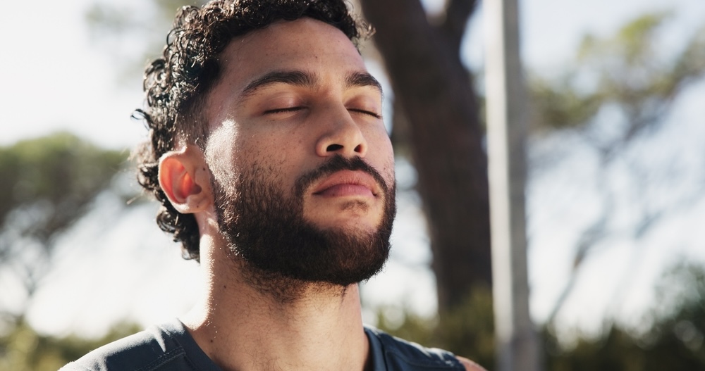 Male meditating after reading sobriety quote