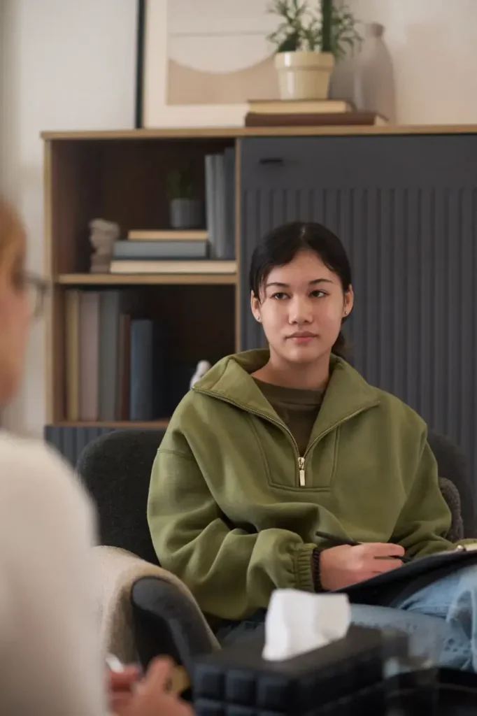 young woman in therapy session indoors 2026 01 09 00 41 09 utc Large - Addiction Treatment at Reviving You Recovery